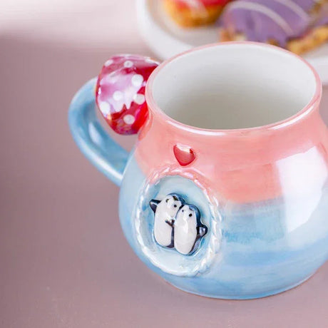 Colorful ceramic mug with pink and blue gradient, penguin design, and red polka dot handle, Turkish kitchenware