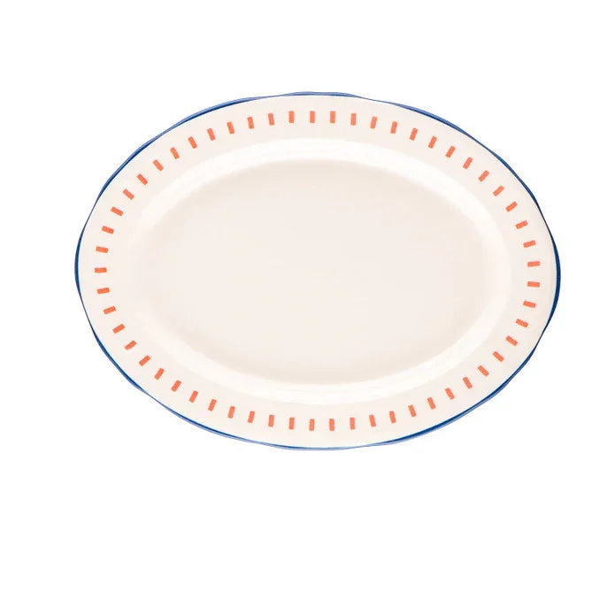 Oval ceramic serving plate with orange dash pattern and blue rim on white background