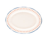 Oval ceramic serving plate with orange dash pattern and blue rim on white background