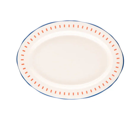 Oval ceramic serving plate with orange dash pattern and blue rim on white background